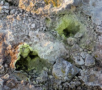 Sulphur fumaroles like these, found in Iceland, are often seen with such volcanic features and are related to the geothermal/geochemistry profile of the magma body.