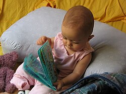 Developmental psychologists engage a child with a book and then make observations based on how the child interacts with the object.