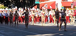 FSU Marching Chiefs and Cheerleaders performing in a parade in Downtown Tallahassee