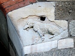 A bas-relief on the Palazzo della Ragione of the scrofa semilanuta ("half-woolly sow") from which, according to a theory, the city's toponym may derive
