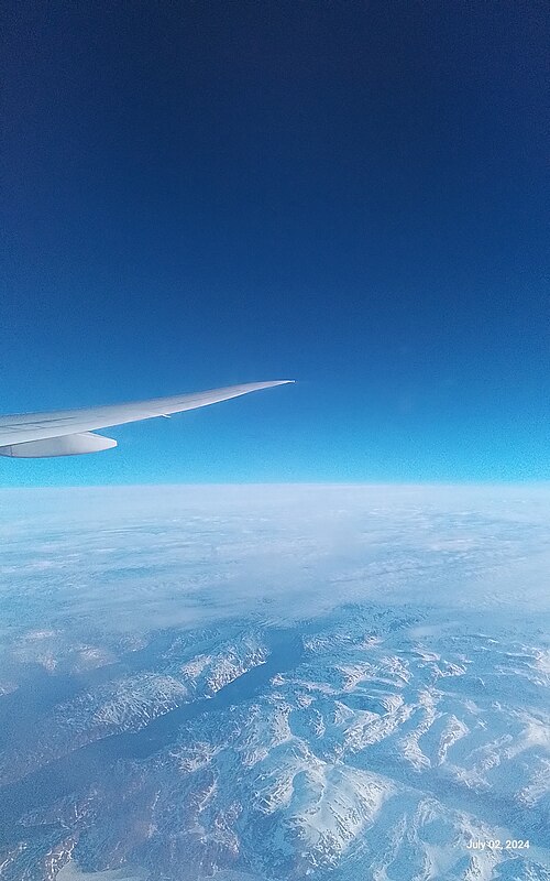 A picture of Earth's atmosphere as viewed from an airplane, traveling over the Arctic.