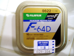 A 100-foot (30.5 m) tin of 16 mm Fujifilm