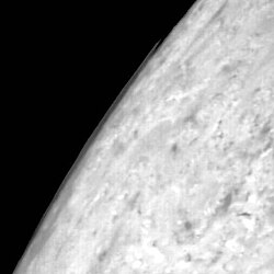 Clouds observed above Triton's limb by Voyager 2