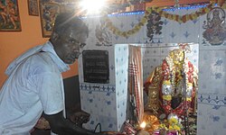 Man doing worship to Maaramma in Mandya district