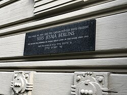 Plaque marking what was once Berlin's childhood home (designed by Mikhail Eisenstein) in Riga, engraved in Latvian, English, and Hebrew with the tribute "The British philosopher Sir Isaiah Berlin lived in this house 1909–1915"