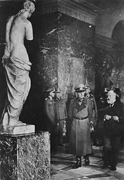 Generalfeldmarschall Gerd von Rundstedt is seen with a plaster model of the Venus de Milo,[65] while visiting the Louvre with the curator Alfred Merlin on 7 October 1940.