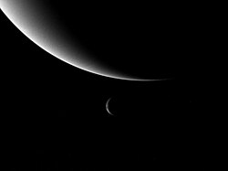 Neptune (top) and Triton (bottom) three days after flyby of Voyager 2