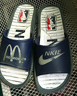 Intellectual property laws such as trademark laws forbid the sale of infringing goods like these "McDnoald's" [sic] and "NKIE" [sic] sandals from China.
