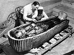 Howard Carter examining the innermost coffin of Tutankhamun