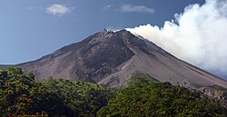Merapi in July 2005. The constant smoke from its summit is said to come from two sacred armourers living under the mountain.