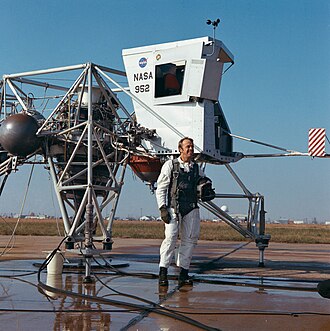 Shepard in front of the Lunar Landing Research Vehicle, flown to simulate the landing
