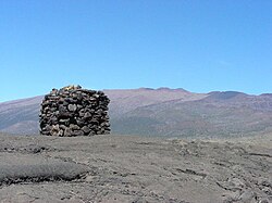 A stone structure or Ahu facing Mauna Kea, on Saddle Road between Mauna Kea and Mauna Loa