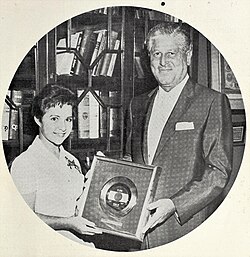Lee presented with a gold record for "I'm Sorry" in 1960