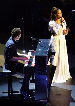 Lewis performing a cover of "Locked Out of Heaven" at the Royal Albert Hall, London on the Glassheart Tour, May 2013