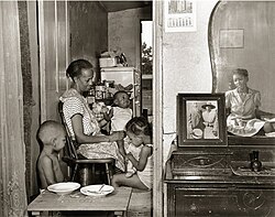 A later photograph in Parks' FSA series shows Ella Watson and her family.
