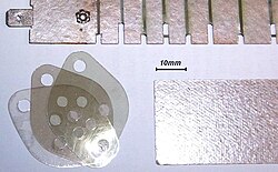 Micanite or mica for isolated mounting of transistors (top, right) and mica discs