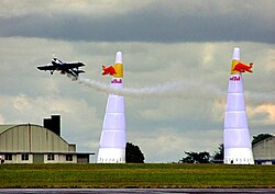 This acrobatic airplane is pulling up in a +g maneuver; the pilot is experiencing several gs of inertial acceleration in addition to the force of gravity. The cumulative vertical axis forces acting upon his body make him momentarily 'weigh' many times more than normal.