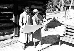 Mary Colter looking at blueprints with Mrs. Ickes, c. 1935