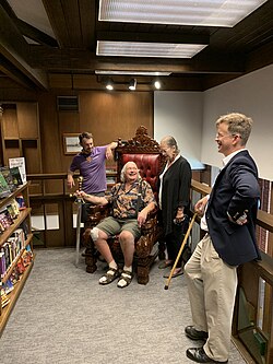Members of the Gygax family pose on the Throne of Reading at the Lake Geneva Public Library.