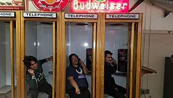 Telephone booths within the dining area of Philippe The Original in Los Angeles.