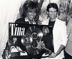 Turner holding certification plaques with Don Grierson