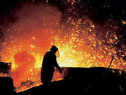During chemical reactions, bonds between atoms break and form, resulting in different substances with different properties. In a blast furnace, iron oxide, a compound, reacts with carbon monoxide to form iron, one of the chemical elements, and carbon dioxide.