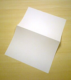 An A4 paper sheet folded into two A5 size pages