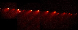 Figure 5: Comet Shoemaker-Levy 9 in 1994 after breaking up under the influence of Jupiter's tidal forces during a previous pass in 1992.