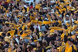 Pittsburgh Steelers' fans waving the Terrible Towel, a tradition that dates back to 1975
