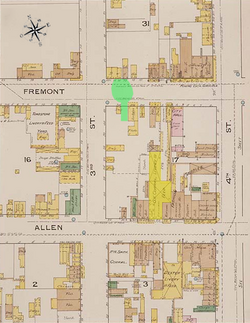 An annotated 1886 fire map of Tombstone, indicating the actual shootout location (in green) and the O.K. Corral (in yellow) on the other side of the block