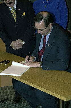Taft signing a bill into law at Rickenbacker Air National Guard Base in 2001