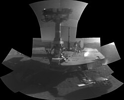 Opportunity's first self-portrait including the camera mast on Mars(February 14−20, 2018 / sols 4998−5004). It was taken with its microscopic imager instrument.