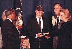 Healy (right) with President George H. W. Bush in 1991, being sworn in as director of the National Institutes of Health