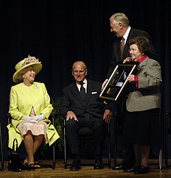Mikulski with Steny Hoyer presenting a photo to Queen Elizabeth II and Prince Philip in Greenbelt, Maryland
