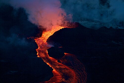 A gentle, or effusive, volcanic eruption, in which liquid material (lava) gently flows from a vent, in this case in south-eastern Hawai’i island