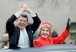 The new president and his wife wave to the crowd during the Inaugural Parade, January 20, 1981, the same day that 52 Americans held hostage by Iran for 444 days were set free