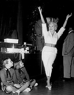 Grable's daughters, Victoria Elizabeth and Jessica, watch her rehearse for her TV debut on Shower of Stars (1954)