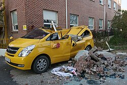 Debris falls on a vehicle after the earthquake in South Korea.