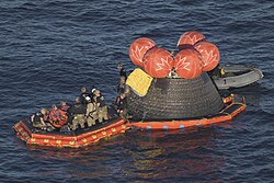 Navy divers helping the crew onto the "front porch"
