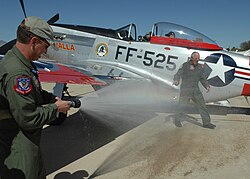 Anders sprayed with a fire hose by his son Greg at Davis–Monthan Air Force Base in 2008