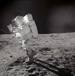 Mitchell studies a map while on the Moon.