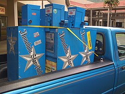Star-Bulletin vending machines being hauled away on the last day of circulation