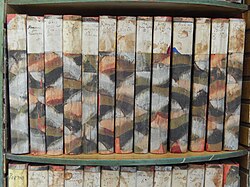 Shelf of Shakespeare plays hand-bound by Virginia Woolf in her bedroom at Monk's House[d]