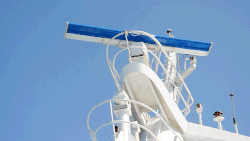 Commercial marine radar antenna. The rotating antenna radiates a vertical fan-shaped beam.