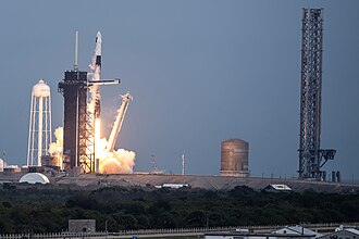 Starship launch tower construction can be seen (right) at LC-39A in January 2024 as Falcon 9 launches continue to take place