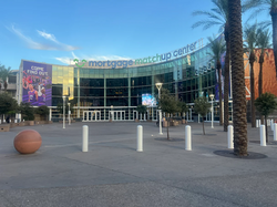photo showing the semi-circular entrance to the Footprint Center in downtown Phoenix, blue sky in background