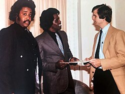 Brown speaking to Lee Atwater in Washington, D.C., with Al Sharpton looking on, 1981