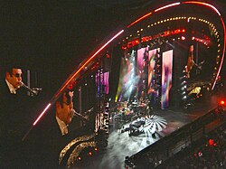 John on piano at the Concert for Diana, commemorating the 10-year passing of Princess Diana, at Wembley Stadium on 1 July 2007