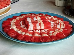 Thin slices of raw beef for hot pot cooking
