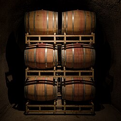 The "red band" on some wine barrels is the residue of spilt red wine. For aesthetics some wineries will paint this center portion of the barrel red for a cleaner look. Rutherford Hill Winery, Napa Valley AVA.